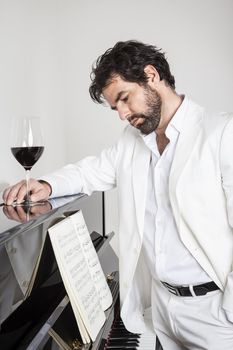 An image of a handsome man and a piano