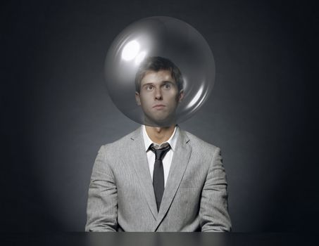 young businessman with head in a transparent bubble