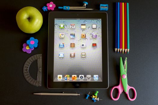 Ipad 3 with school accesories on white background