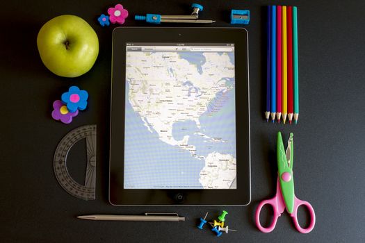 Ipad 3 with school accesories on white background