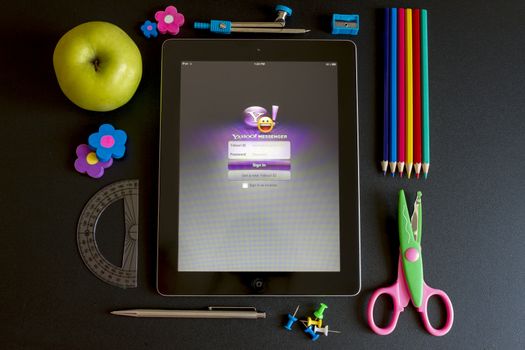 Ipad 3 with school accesories on white background