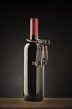wine bottle with old iron keys