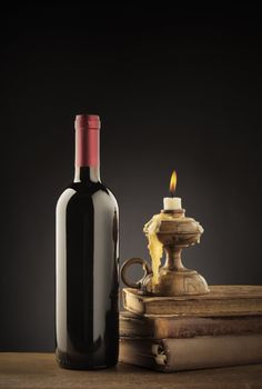 Wine bottle,old books and candle