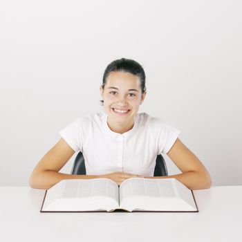 Young girl with book, smiling