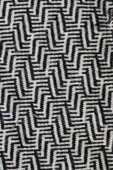 Interesting closeup texture pattern of garment dress cloth black and white ornaments.