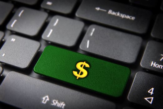 Make money with internet: green key with golden dollar currency symbol on laptop keyboard. Included clipping path, so you can easily edit it.