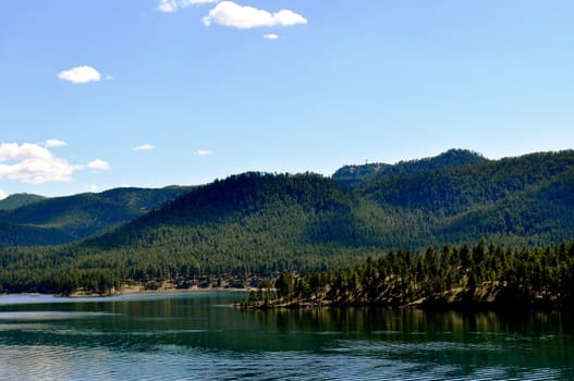 Black hills and water background