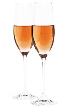two glasses of rose bubbly champagne on white background