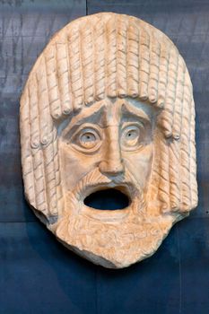 Roman mask of stone in Coliseum. Rome