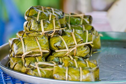 Thai bananas in sticky rice, khao tom mad, thai food