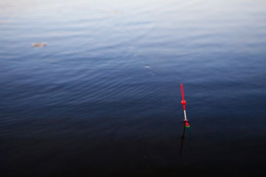 background with a red bobber on the river