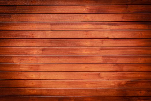 Wood texture background in horizontal pattern, dark brown color.