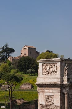 An old building on the hill and an triumphal arch in Rome
