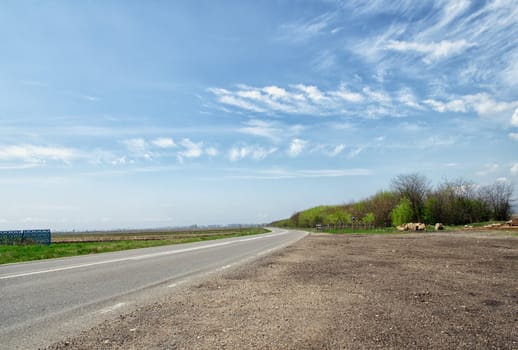 Country road with blue sky in the summer