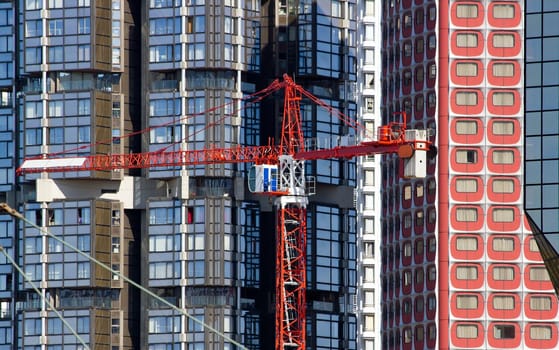 crane on the background of modernity, contrasts horizontality and verticality