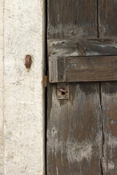 old closed wooden door inthe countryside