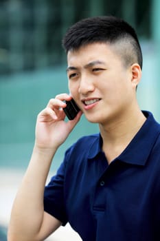 asian man with cell phone