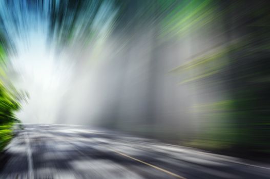 motion blurred road and cloudy blue sky background