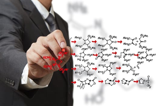 chemist draws a molecular structure