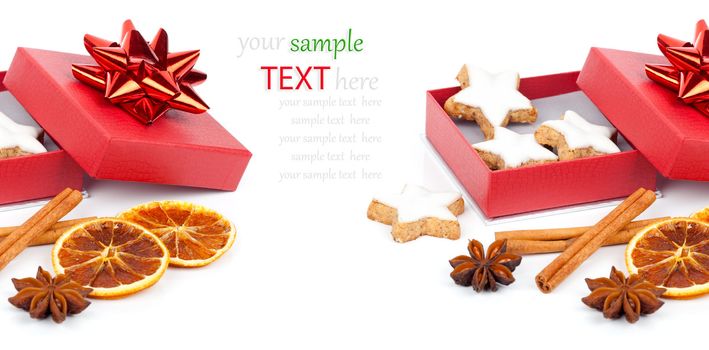 star shaped cinnamon biscuit in red box with Anise, cinnamon and orange on white background