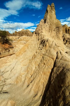 A white stone pillar rising in Tatacoa Desert in Colombia.