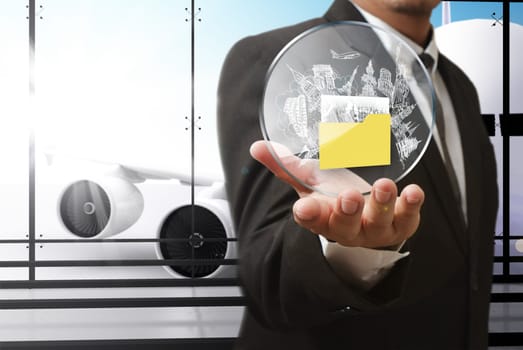 business man hand shows travel shield at the airport