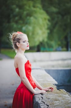 model, red, dress, flower, hair, light, look, lipstick, fall, girl, trees, sun, blue, beauty, grace, eyes, waiting, pier, concrete