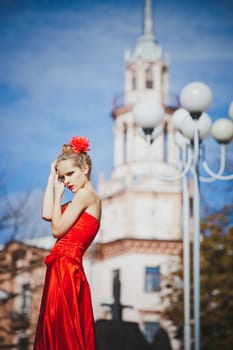 model, red, dress, flower, hair, light, look, lipstick, fall, girl, trees, sun, blue, beauty, grace, eyes, helplessness, city, buildings