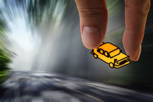 hand picks pixel car icon on the road with motion blur background as concept