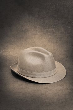 Sepia toned image of a vintage trilby hat.