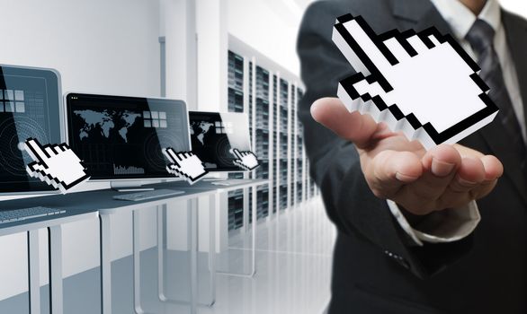 business man hand shows hand cursor in computer center room