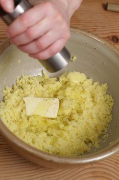 preparing creamy mashed potatoes in a  bowl