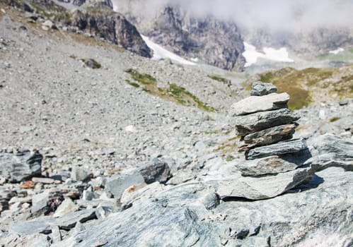 Italy, Monviso mountain. A path sign close to the top of one of the most scenic mountain of Alps.
