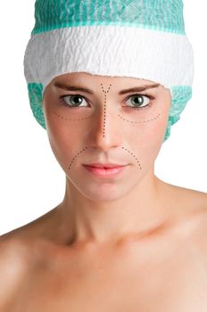 Young woman with markings for a facial cosmetic plastic surgery