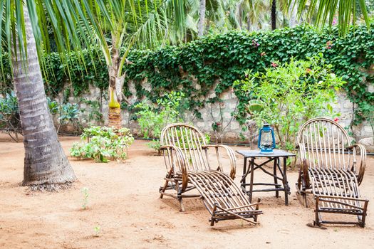 Kenya. Elegant furniture made of wood in an African garden