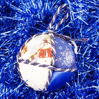 Italy. Traditional handmade Christmas ball made of white and blue fabric