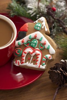 Cropped image of coffee cup with gingerbread house.