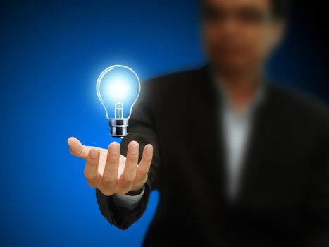 Businessman hand hold a light bulb