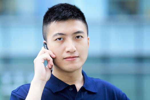 asian man with cell phone