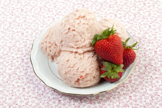 Fresh strawberry gelato with strawberry fruits on a plate