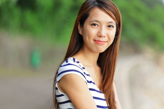 young woman smiling friendly outdoor