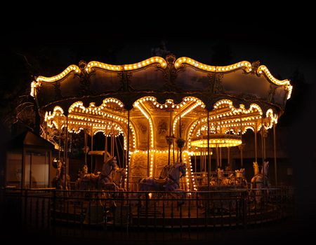 Traditional carousel wheel empty night black background