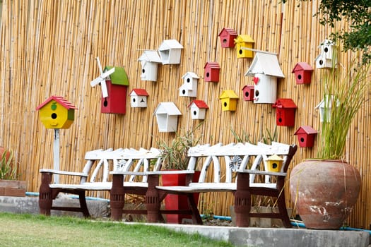 Vintage Bench and Wood wall with Bird's nest