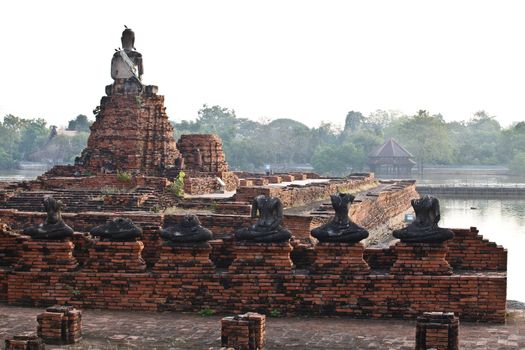 Buddha statues and Floods Chaiwatthanaram Temple at Ayutthaya, Thailand