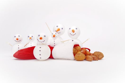 many funny selfmade snowmen isolated on white background