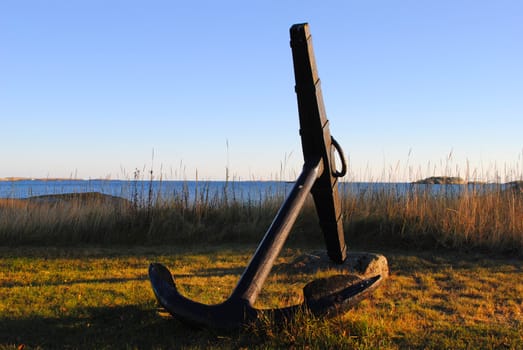 A decorative anchor in a garden.