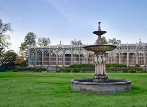 Old greenhouse and fountain outside Racconigi castle, Italy