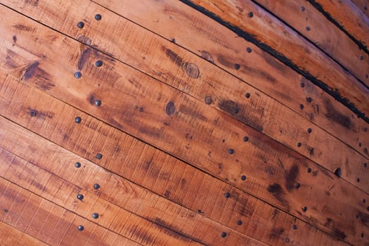 Wooden planks and nails from hull of an old ship.