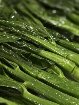 close up of stir fried  kai-lan chinese broccoli