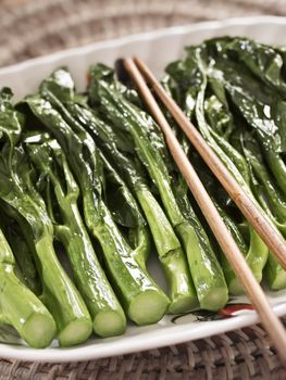 close up of stir fried kai-lan chinese broccoli